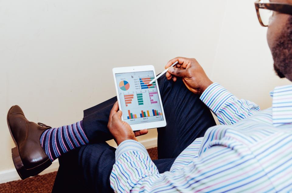 Reviewing financial charts on a tablet